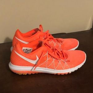 Orange Nike running shoes